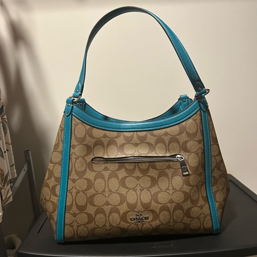 This Coach Kristy Shoulder Tote Hobo Bag in Signature Canvas